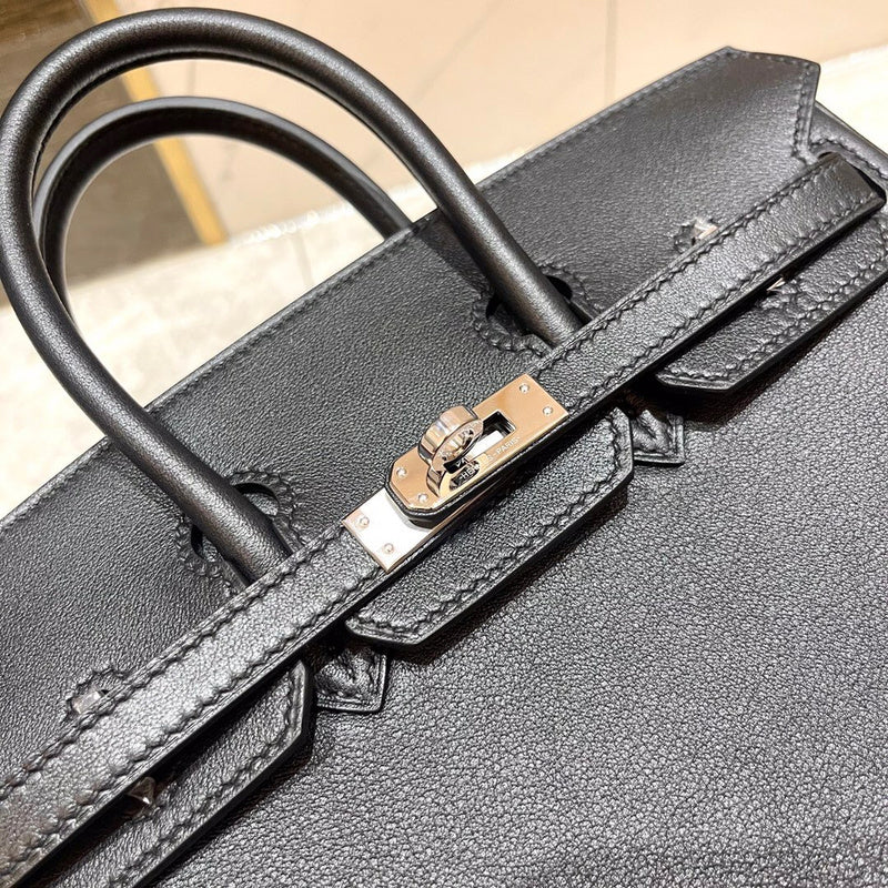 Side view of understated structured handbag