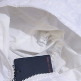 Back view of Louis Vuitton luxury clothing with label-forward styling