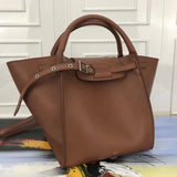 Close-up detail of modern signature women's handbag – women's designer-style accessory