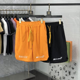 Side profile of Rhude luxury clothing with label-forward styling