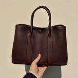  polished shoulder bag detail view showing craftsmanship 8
