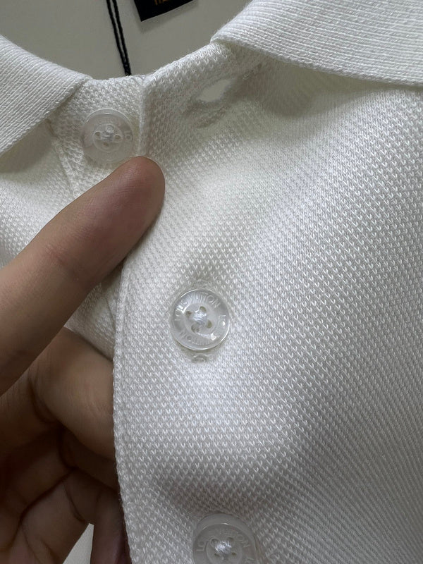 Front view of Louis Vuitton luxury clothing with logo-detail design