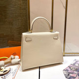 Side view of streamlined structured handbag