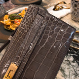 Side view of poised structured handbag