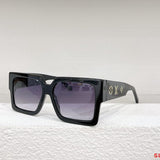Close-up detail view of Louis Vuitton unisex sunglasses