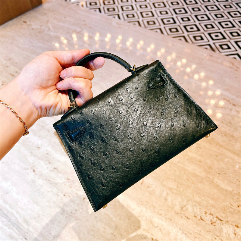  Understated top-handle bag carried on shoulder 16