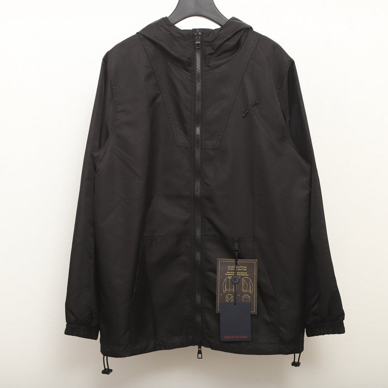 Close-up detail shot of Louis Vuitton luxury clothing with logo-detail design
