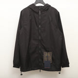Close-up detail shot of Louis Vuitton luxury clothing with logo-detail design