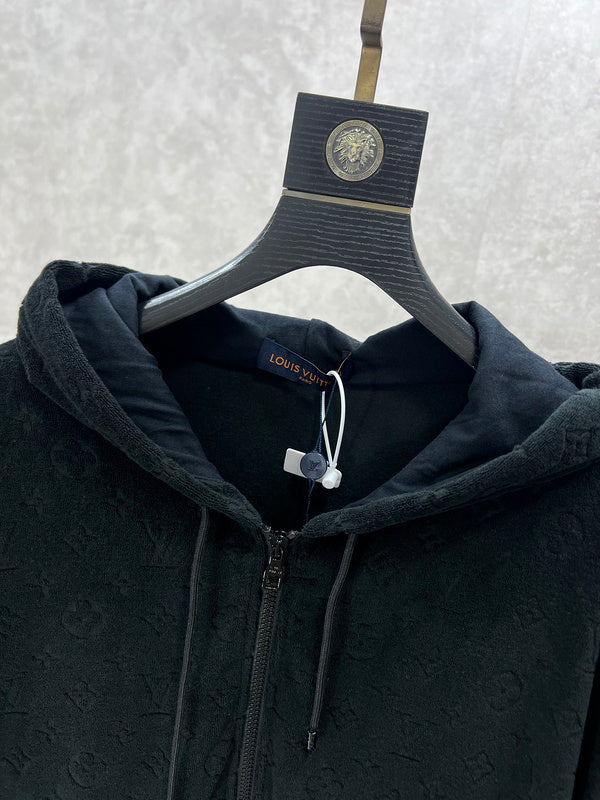 Close-up detail shot of Louis Vuitton luxury clothing with runway-inspired design