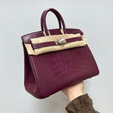Side view of streamlined structured handbag