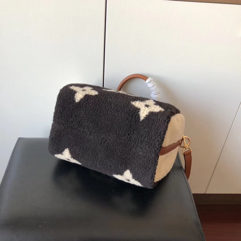Side profile of signature premium women's handbag – women's statement bag