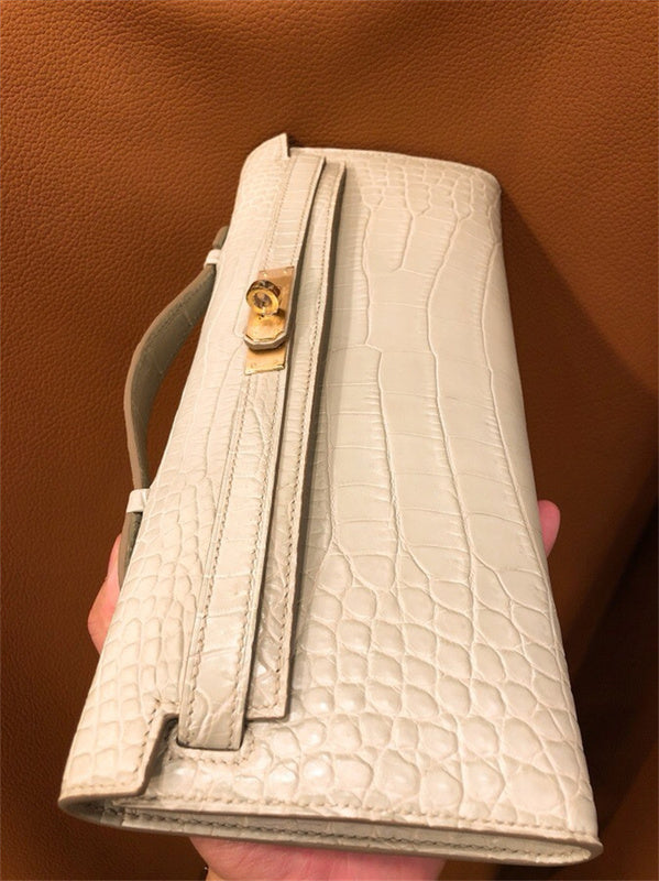 Side view of poised structured handbag