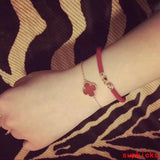 Lifestyle view of Van Cleef & Arpels unisex jewelry piece
