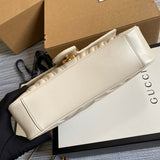 Handle and strap detail of signature polished women's handbag – women's designer-style accessory