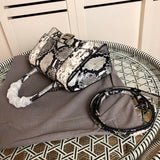 Styled lifestyle shot of everyday-luxe chic women's handbag – women's luxury handbag