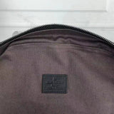 Back view of signature classic women's handbag – women's luxury handbag