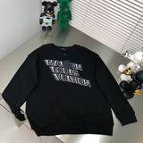 Front view of Louis Vuitton luxury clothing with signature branding