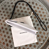 Handle and strap detail of classic statement women's handbag – women's everyday handbag