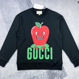 Front view of Gucci luxury clothing with signature branding