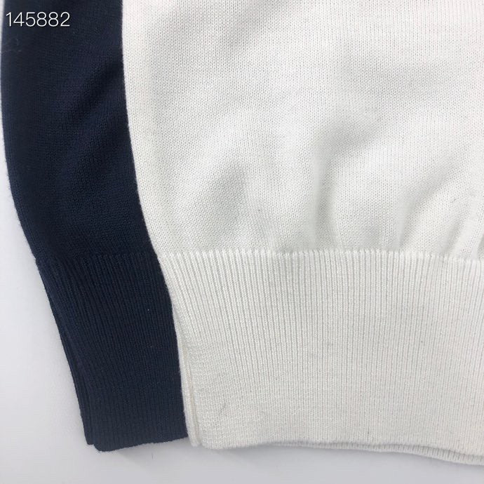 Close-up detail shot of Louis Vuitton luxury clothing with relaxed-fit cut