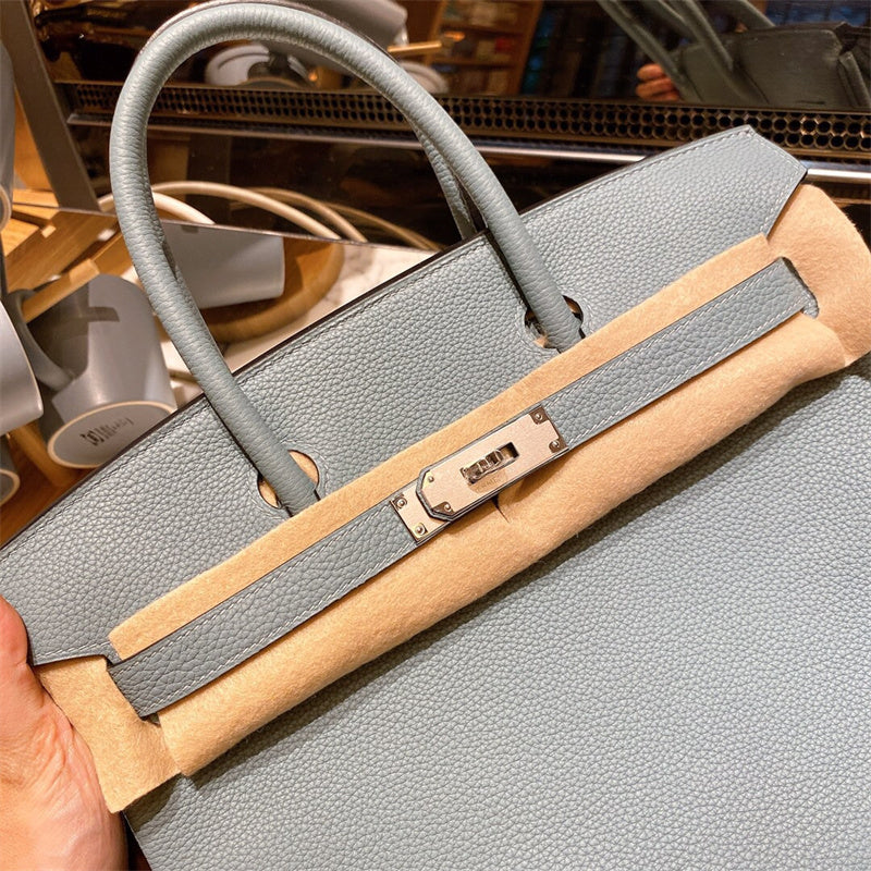  classic top-handle bag styled with outfit