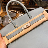  classic top-handle bag styled with outfit