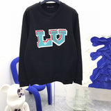 Front view of Louis Vuitton luxury clothing with runway-inspired design