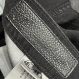 Detail shot of Chrome Hearts Jeans premium leather texture