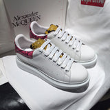 Alexander McQueen fresh white-and-black luxury sneakers view 5 signature lace-up style