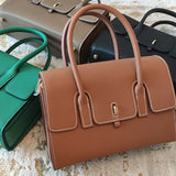 Side view of sculpted structured handbag