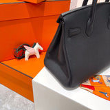 Side view of contemporary structured handbag
