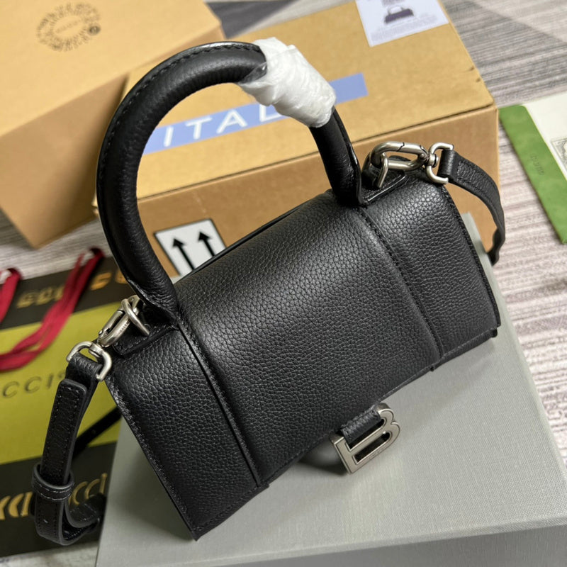 Side profile of modern sleek women's handbag – women's statement bag