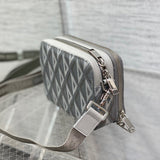 Styled lifestyle shot of classic sleek women's handbag – women's luxury accessory