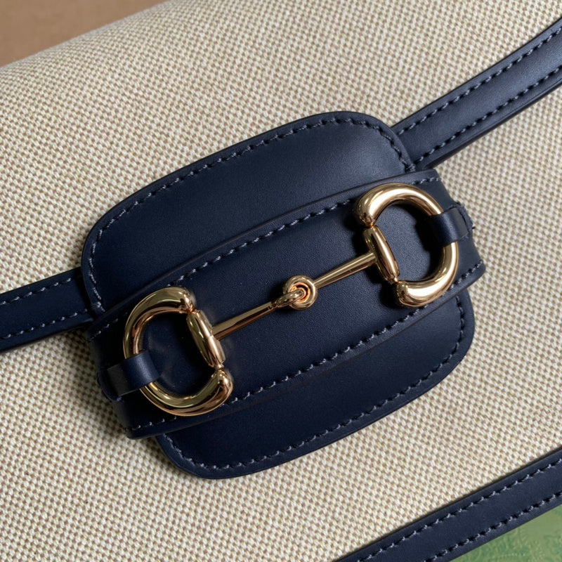 Handle and strap detail of sleek modern women's handbag – women's statement bag