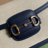Handle and strap detail of sleek modern women's handbag – women's statement bag
