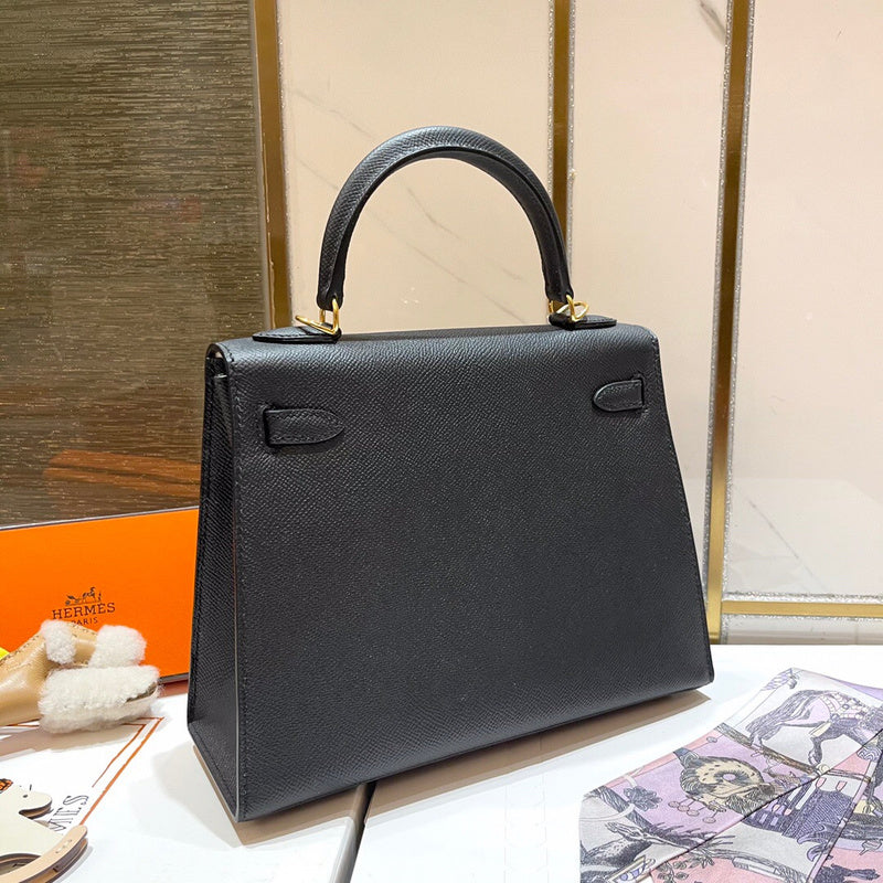 Side view of streamlined structured handbag