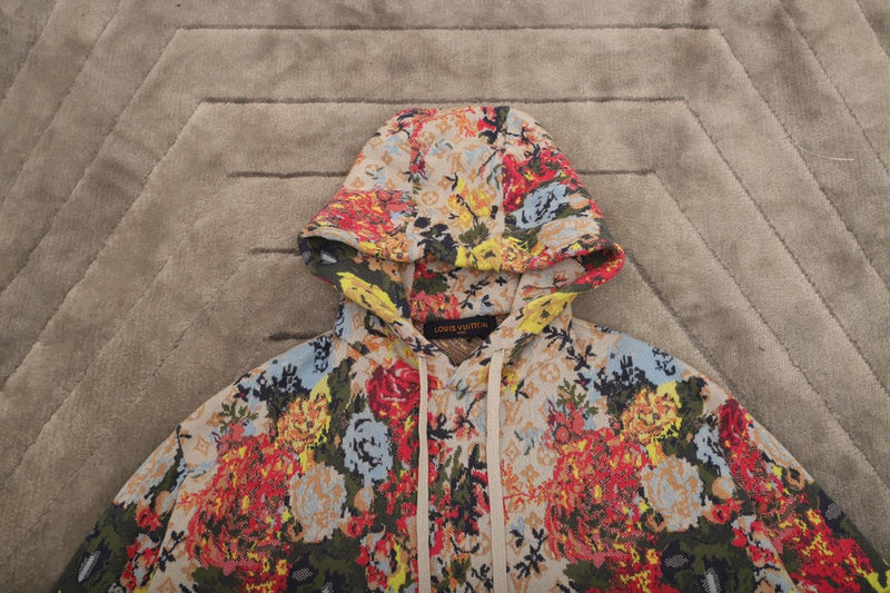 Back view of Louis Vuitton luxury clothing with label-forward styling