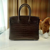 Side view of classic structured handbag