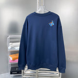 Side profile of Louis Vuitton luxury clothing with label-forward styling