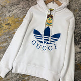 Close-up detail shot of Gucci luxury clothing with label-forward styling