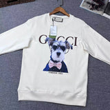 Flat lay presentation of Gucci luxury clothing with signature branding