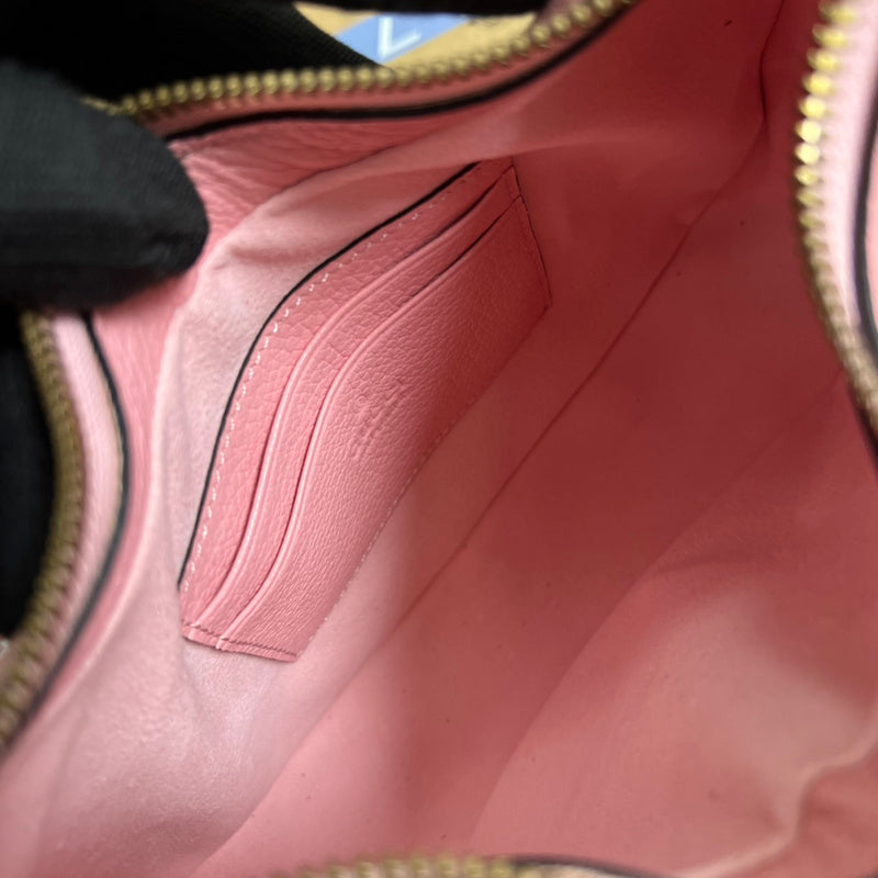 Close-up detail of statement signature women's handbag – women's luxury accessory