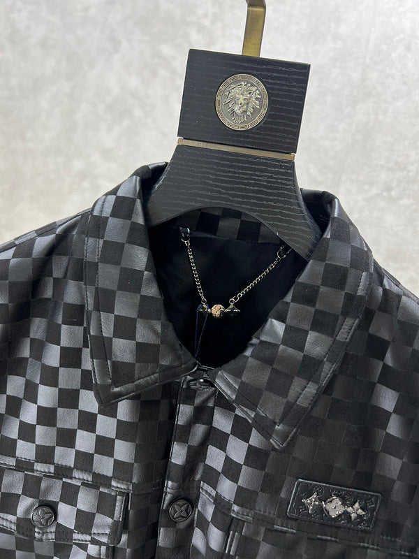 Close-up detail shot of Louis Vuitton luxury clothing with label-forward styling