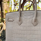 Side view of structured structured handbag