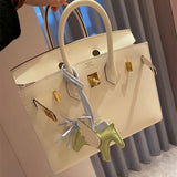 Side view of poised structured handbag