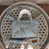 Handle and strap detail of structured everyday-luxe women's handbag – women's designer-style accessory