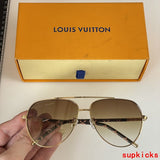 Close-up detail view of Louis Vuitton unisex sunglasses