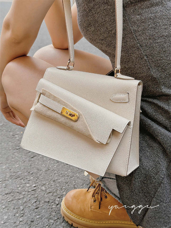 Side view of sculpted structured handbag