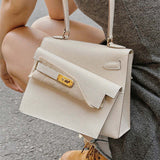 Side view of sculpted structured handbag