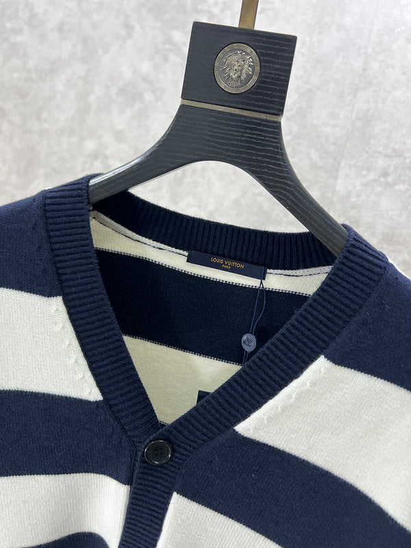 Close-up detail shot of Louis Vuitton luxury clothing with label-forward styling